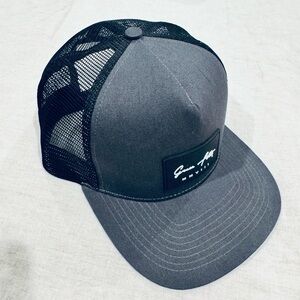 Grace Folly trucker hat.  Gray front. Black mesh.